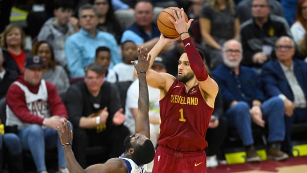 Feb 27, 2024; Cleveland, Ohio, USA; Cleveland Cavaliers guard Max Strus (1) makes a three-point basket beside Dallas Mavericks forward Tim Hardaway Jr. (10) in the fourth quarter at Rocket Mortgage FieldHouse. Mandatory Credit: David Richard-USA TODAY Sports  